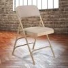 National Public Seating 2301 Beige Metal Folding Chair With 1 1/4" Cafe Beige Fabric Padded Seat