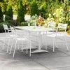 Lancaster Table & Seating 32" X 60" White Powder-Coated Aluminum Dining Height Outdoor Table With Umbrella Hole And 4 Arm Chairs