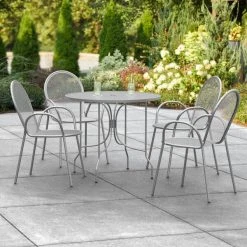 Lancaster Table & Seating Harbor Gray 36" Round Outdoor Standard Height Table With Ornate Legs And 4 Arm Chairs