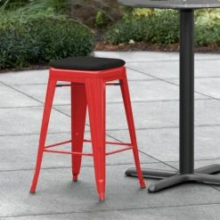 LT&S Alloy Series Lancaster Table & Seating Alloy Series Red Stackable Metal Indoor / Outdoor Industrial Cafe Counter Height Stool With Black Fabric Magnetic Cushion