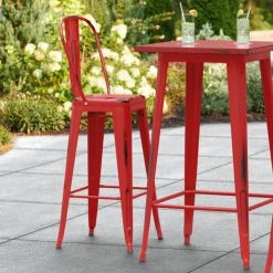 LT&S Alloy Series Lancaster Table & Seating Alloy Series Distressed Red Metal Indoor / Outdoor Industrial Cafe Barstool With Vertical Slat Back And Drain Hole Seat